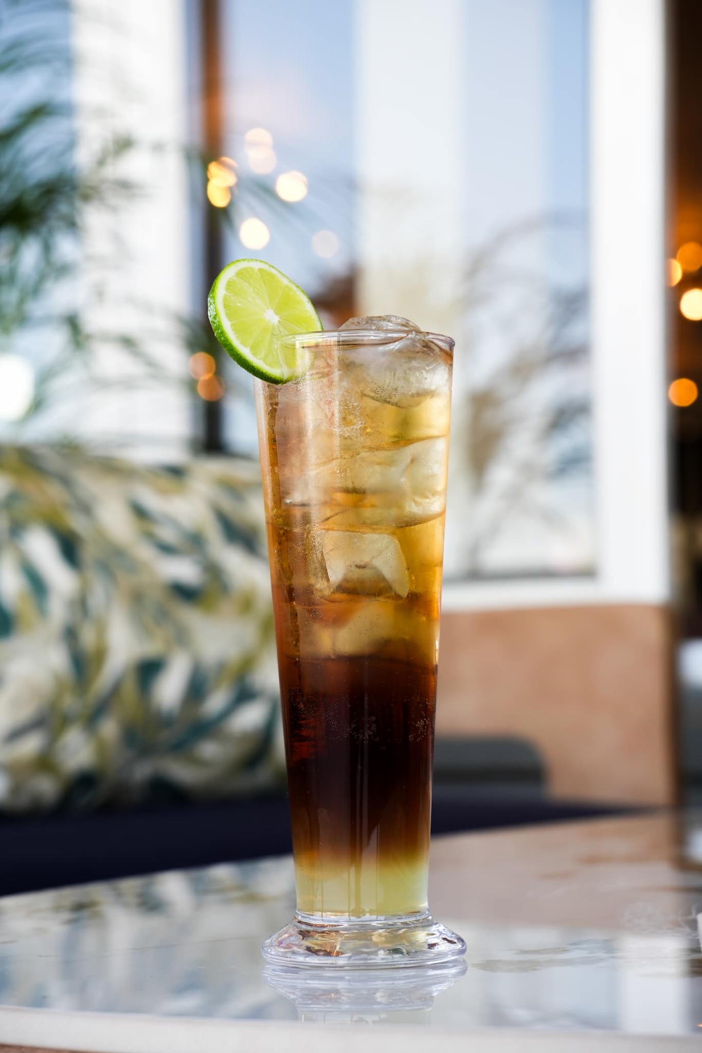 Tall mixed drink with lime